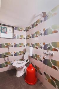 a bathroom with a toilet and a fire hydrant at 5.MidTown-1BHK, Hitech City (prepaid homes) in Hyderabad