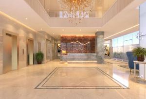 a lobby with a fireplace and a chandelier at Enrise by Sayaji Nagpur in Nagpur