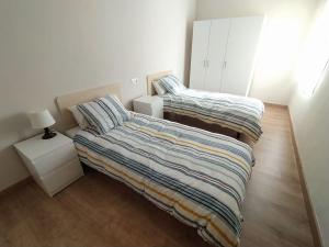 Кровать или кровати в номере FC Temple Ponferrada