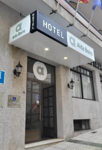 a hotel sign on the front of a building at Hotel Alda Boiro in Boiro