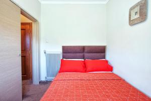 A bed or beds in a room at Anastassiou Hotel - Bike and motorcycle friendly hotel