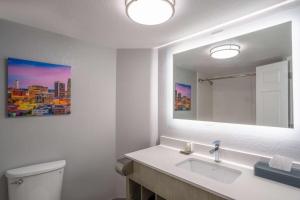 a bathroom with a sink and a mirror at La Quinta by Wyndham Birmingham Hoover in Hoover