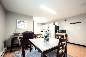 a kitchen and dining room with a table and chairs at The Terrace at Park Place 2nd floor walk up -cozy 2 bedroom fast WiFi free coffee in Wilmington