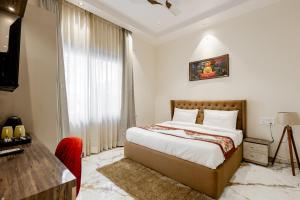 Ένα ή περισσότερα κρεβάτια σε δωμάτιο στο Lime Tree B&B Pari Chowk