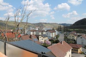 a view of a town with houses and a road at Moderne Wohnung mit Ausblick in Niedernhall