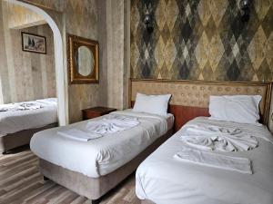 Postel nebo postele na pokoji v ubytování Asitane City Life Hotel