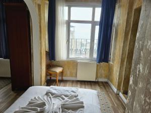 Postel nebo postele na pokoji v ubytování Asitane City Life Hotel