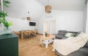 a living room with a couch and a table at Villa Ivana Whisper of nature in Vodice