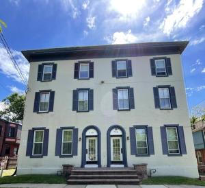 a large white house with black shuttered windows at The Grayson at Park Place- cozy and fully updated with King bed free coffee and fast WIFI in Wilmington