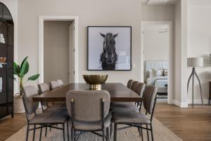 a dining room with a table and a horse picture on the wall at Bunker on the 8th in Washington