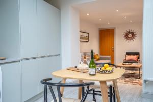 a kitchen and dining room with a table and chairs at The Smithy in York