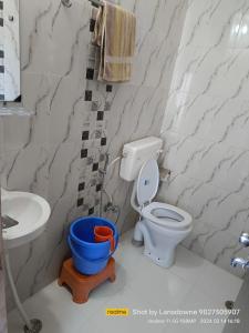 a bathroom with a toilet and a sink at Joshi Holiday Home Stay in Lansdowne