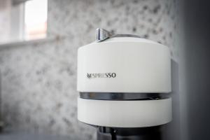 a white mixer sitting next to a wall at The Smithy in York