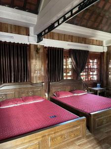 Ένα ή περισσότερα κρεβάτια σε δωμάτιο στο Phố Thiên Đường Homestay