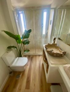 a bathroom with a toilet and a sink at Casa Tela Marinera in El Cotillo