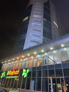 a building with a sign in front of it at Blue Residence Baku in Baku