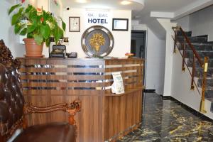 a lobby of a hotel with a clock on a counter at HOTEL GLOBAL 2022 in Istanbul