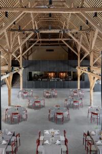 a large room with tables and chairs in it at Broløkke Herregård in Humble