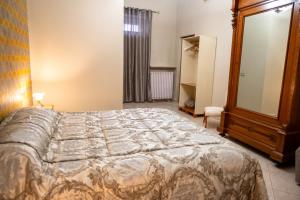 Rúm í herbergi á Casa Luca - Siti storici e ottima cucina locale