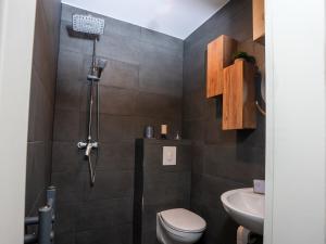 a bathroom with a shower and a toilet and a sink at SR24 - Space in Oer-Erkenschwick in Oer-Erkenschwick