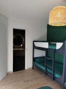 a room with a bunk bed and a window at Chalet côté montagne in Oz