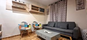 a living room with a couch and two chairs at DS Casa San Fernando in Córdoba +22 photos