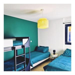 Chalet côté montagne 객실 침대