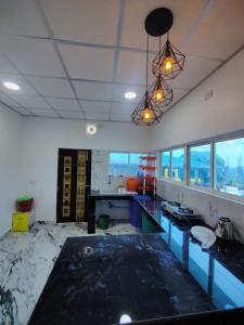 an empty kitchen with a mess on the floor at Kalapani Seaview Service Apartment in Aberdeen