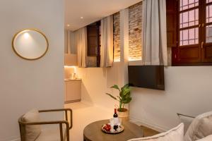 Televízia a/alebo spoločenská miestnosť v ubytovaní Coeo Fresca Design Apartments