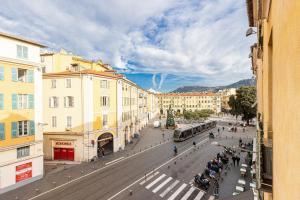 a view of a city street with a bus at Garibaldi Square - Cosy 1bdr in the Old Town in Nice