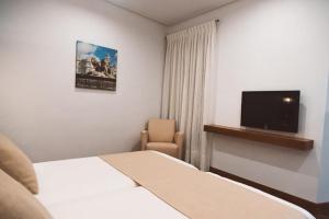 Postel nebo postele na pokoji v ubytování Ferreira Hostal Boutique