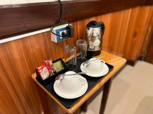 Příslušenství pro přípravu čaje a kávy v ubytování Desert Rose Beach Hotel