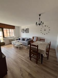 a living room with a table and a couch at Casa Vazan in Laguna Dalga