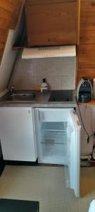 a small kitchen with a sink and white cabinets at Po1-TPSA06-5D- ROOM Porte 20 in Paris +9 photos