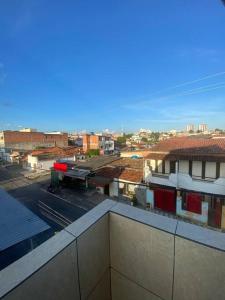 a view of a city from a building at Flat para casal/amigos/familia in Feira de Santana