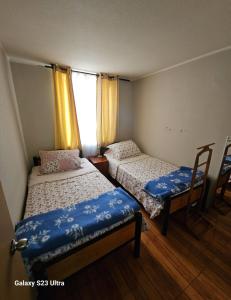 Un pat sau paturi într-o cameră la Departamento chillan