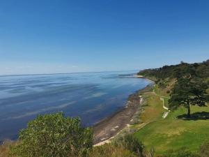 a view of the shoreline of a lake at Beautiful 3 bedroom house with Corio Bay view at heart of Clifton Springs in Clifton Springs