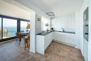 A kitchen or kitchenette at Hostal Sa Malica