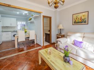 a living room with a couch and a table at Cubo's Apartamento Gongora A & B in Alhaurín el Grande