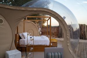 a bedroom in a dome tent with a bed in it at Bubble Room Suite Experience - Bolla Savio Ravenna in Savio di Ravenna