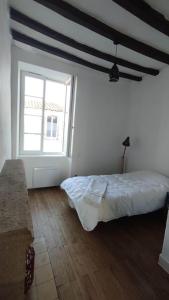 Ein Bett oder Betten in einem Zimmer der Unterkunft Chez Maria Maison de bourg 4 Ch + jardin