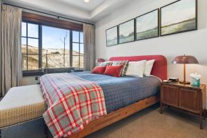 a bedroom with a bed and a window at Flagstaff #203 in Park City