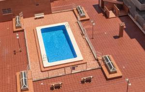 an overhead view of a swimming pool on a building at Stunning Apartment In Castell De La Plana With Kitchen in Castellón de la Plana