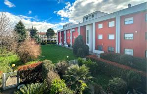 an apartment building with a garden in front of it at 3 Bedroom Awesome Home In Bergamo in Bergamo