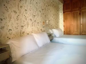 Postel nebo postele na pokoji v ubytování Hostal As Margaritas