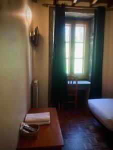 Postel nebo postele na pokoji v ubytování Hostal As Margaritas