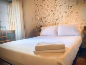 Postel nebo postele na pokoji v ubytování Hostal As Margaritas