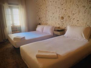 Postel nebo postele na pokoji v ubytování Hostal As Margaritas