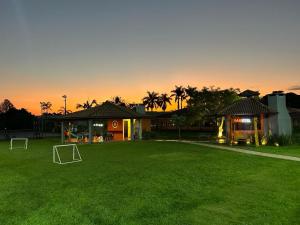 a house with a soccer field in the yard at Olinda Hotel e Eventos in Toledo