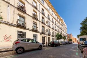 a car parked on a street next to a building at 2 bedrooms 1 bathroom furnished - Lavapies - Modern Cozy - MintyStay in Madrid